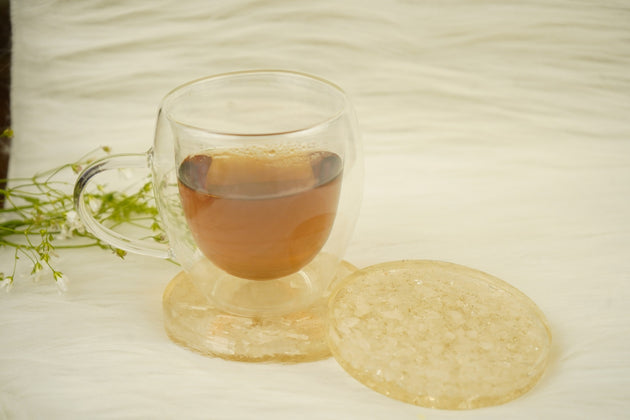 selenite orgonite coaster pair with a cup on top 