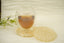 selenite orgonite coaster pair with a cup on top 