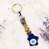 Colorful keychain with a blue evil eye charm on a white background