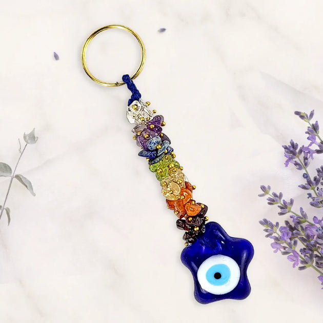 Colorful keychain with a blue evil eye charm on a white background