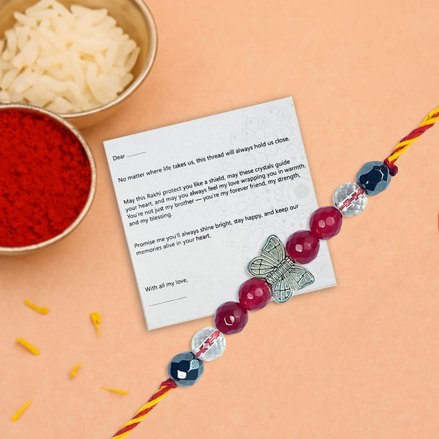 Rakhi with a card on an orange background