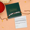Rakhi with crystals on a green box labeled 'Calminds' with a message card.