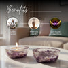 Two crystal bowls with a candle on a table, labeled with benefits of stress relief, mental clarity, and spiritual protection.