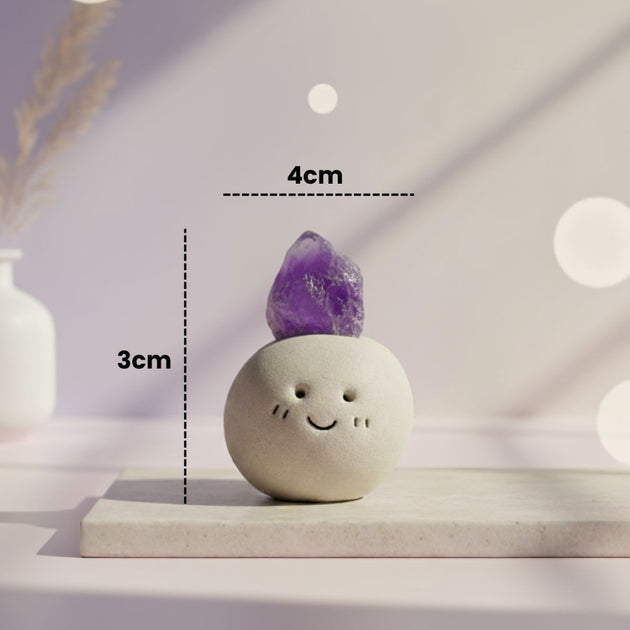 Small decorative item with a purple crystal on top, placed on a white surface with measurement labels.