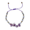 braacelet with purple and gold beads on a white background