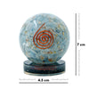 Decorative sphere with a copper spiral on a white background, accompanied by measurement indicators.