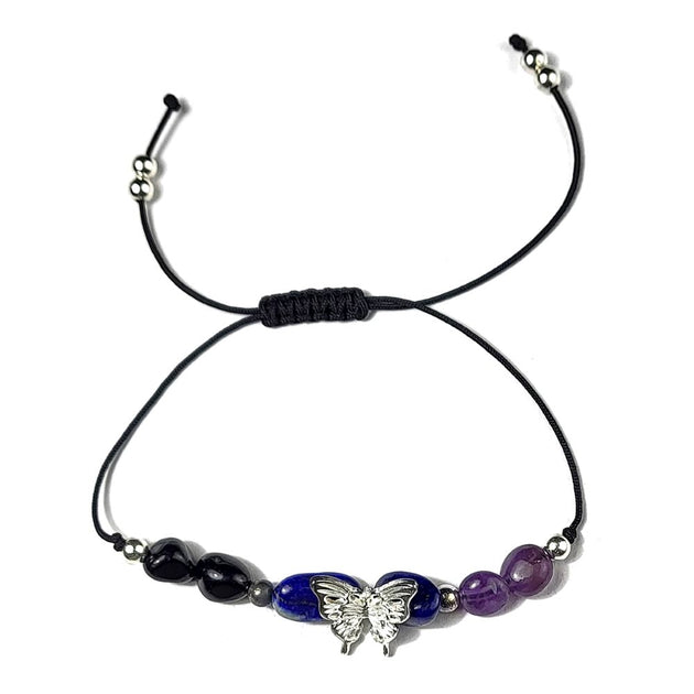 bracelet with butterfly charm and beads on a white background