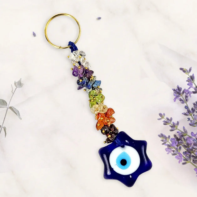 Colorful keychain with star-shaped evil eye charm on a white background