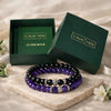 Two beaded bracelets on a stone surface with 'CALM NDS' branded boxes in the background.