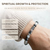 Black and white beaded crystal bracelet on a wrist with text about spiritual growth and protection.