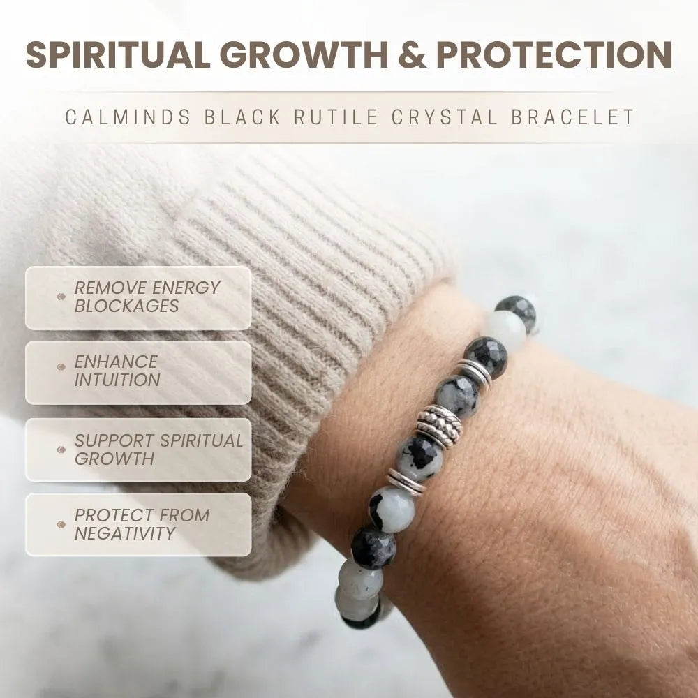 Black and white beaded crystal bracelet on a wrist with text about spiritual growth and protection.