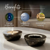 Crystal ball with engraved design on a wooden surface, labeled with benefits.