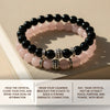 Stack of black and pink beaded bracelets on a textured surface with text instructions.