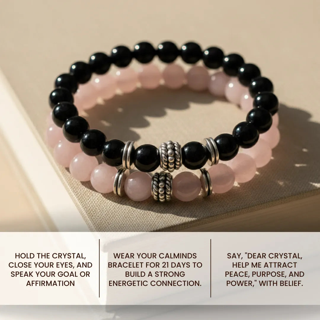 Stack of black and pink beaded bracelets on a textured surface with text instructions.