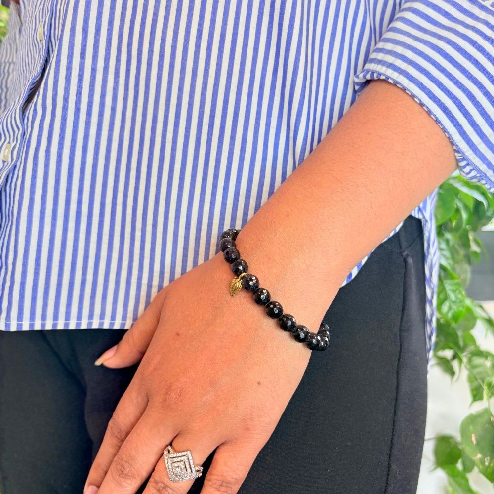 woman wearing a Black Tourmaline bracelet on her left hand