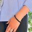 woman wearing a Black Tourmaline bracelet on her left hand