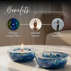 Two glass bowls with blue stones and a lit candle on a reflective surface, with text indicating benefits.