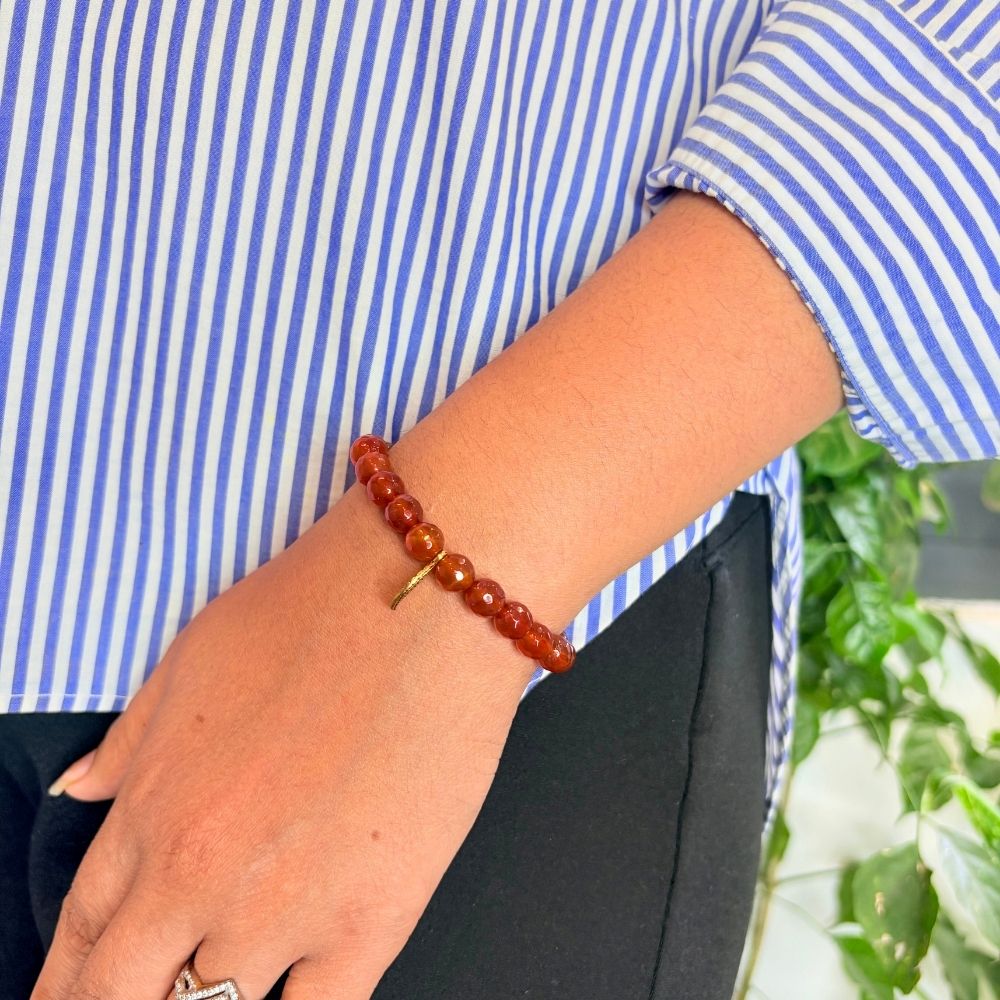 woman wearing a Carnelian Charm Crystal bracelet on her left hand