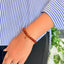 woman wearing a Carnelian Charm Crystal bracelet on her left hand