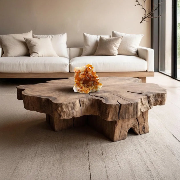 Wooden coffee table with a decorative crystal in a modern living room.
