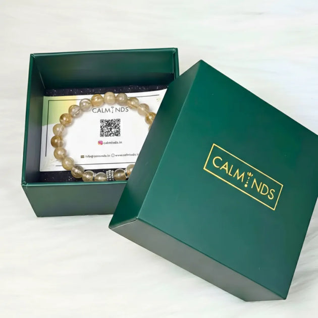 Green box with a pearl bracelet and 'Calm Minds' branding on a white background