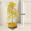 Decorative yellow tree with measurements on a neutral background