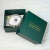 Green box with a bracelet and card inside, branded 'CALM NDS'.