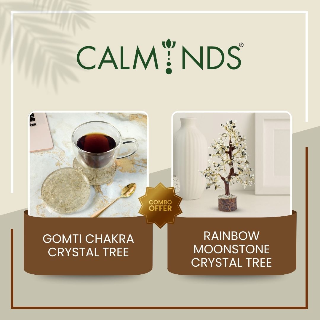 product display with crystal tree and coaster under a cup of tea on a beige background