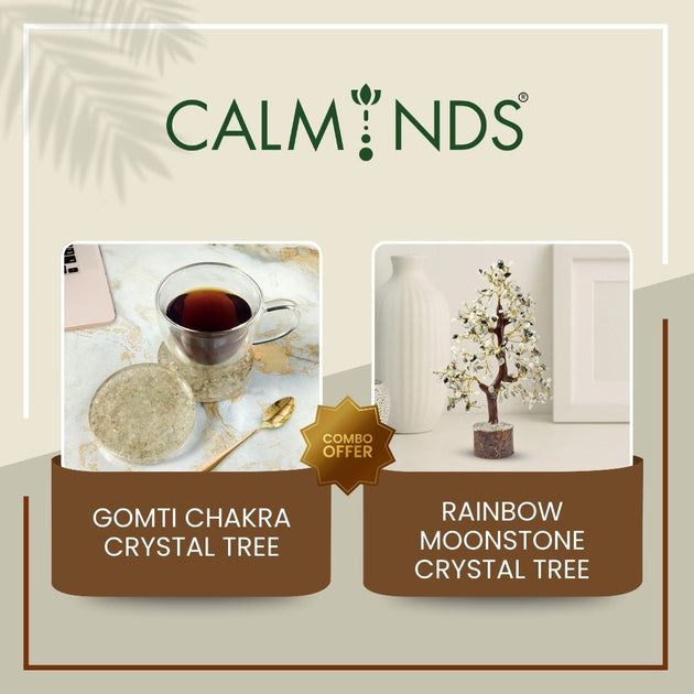 product display with crystal tree and coaster under a cup of tea on a beige background