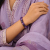 Cylindrical amethyst bracelet worn on wrist