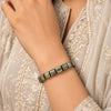 Cylindrical pyrite bracelet worn on wrist