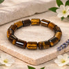Cylindrical tiger eye crystal bead bracelet by Calminds