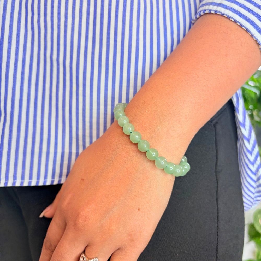 woman wearing a Green Aventurine Crystal bracelet on her left hand