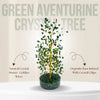 Green aventurine crystal tree with text describing its components on a beige background