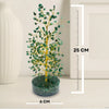 Decorative tree with green leaves on a round base, next to a height measurement chart.