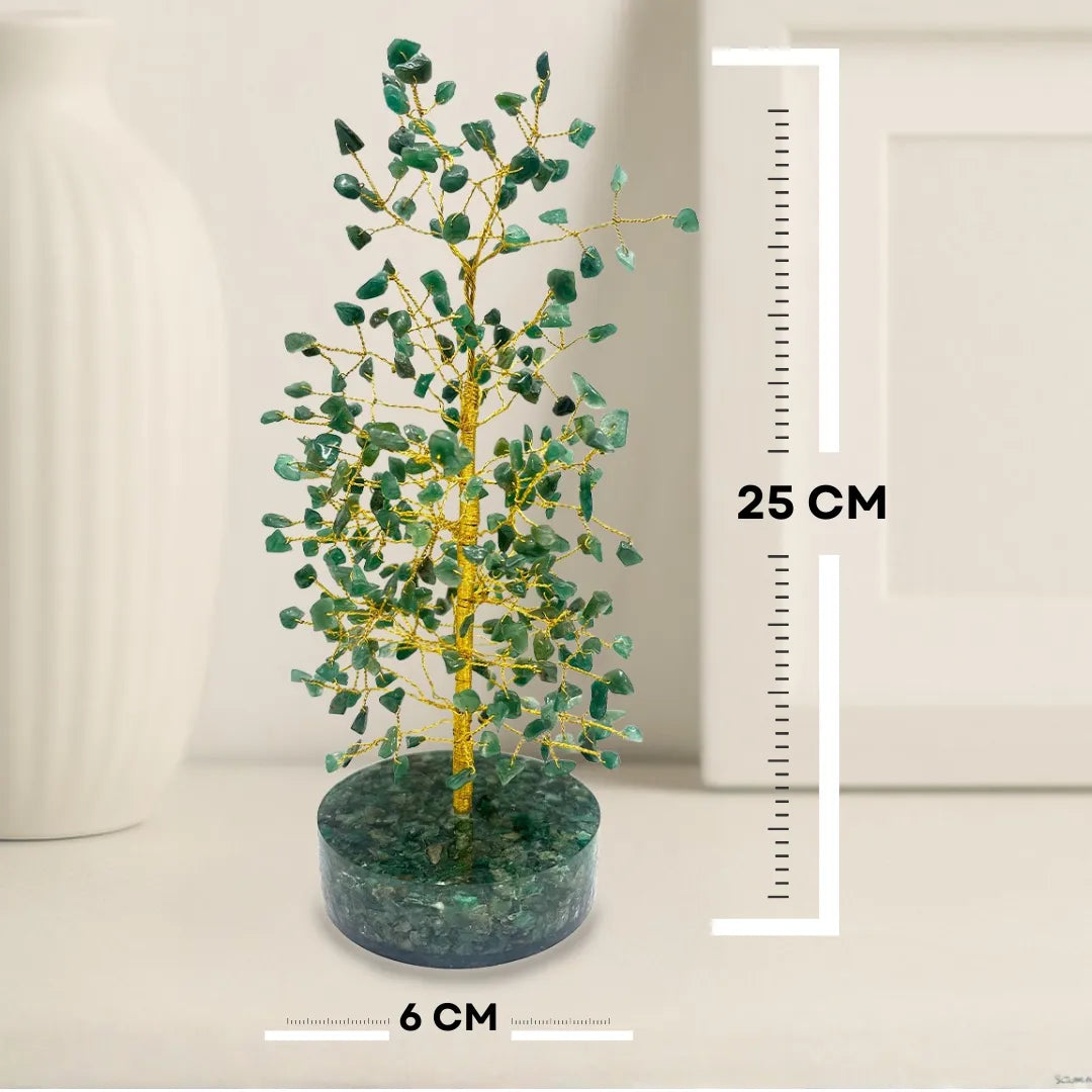 Decorative tree with green leaves on a round base, next to a height measurement chart.