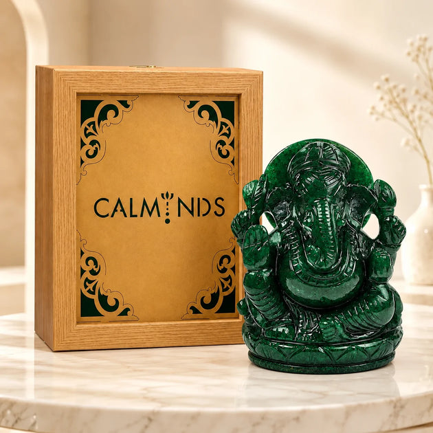 Green aventurine Ganesha idol beside a wooden Calminds gift box