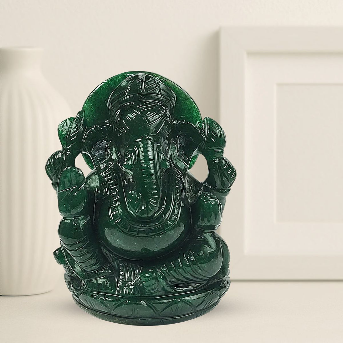 Hand-carved green jade Ganesha idol, 6 inch, seated with carved prabhavali