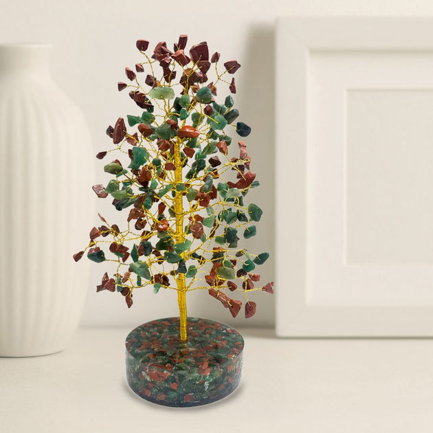 Decorative tree made of colored stones on a white background