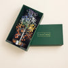 seven chakra crystal tree in a green box with 'Calminds.'