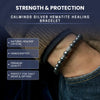 Silver hematite healing bracelet on a wrist with promotional text about its features.