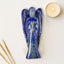 blue color lapis lazuli angel figurine on a white surface 