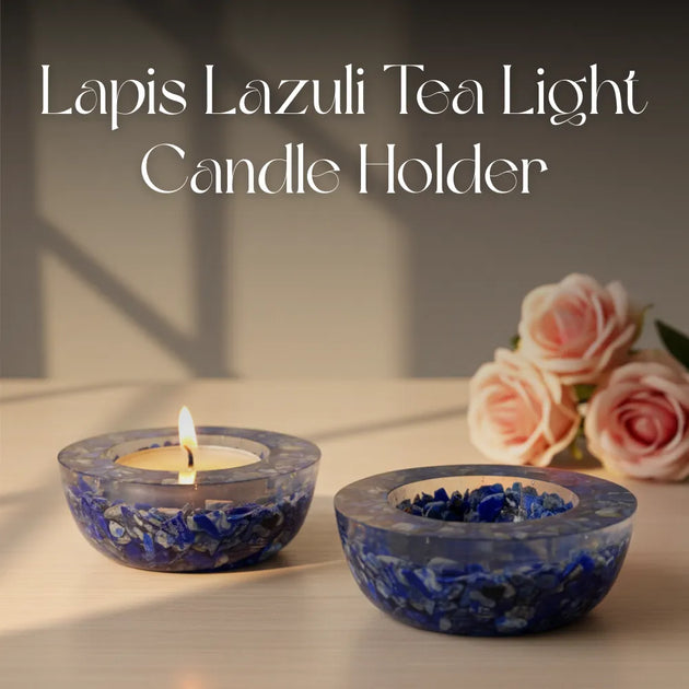 Amethyst crystal ball with candles in the background on a dark surface