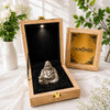 Pyrite Laughing Buddha in a wooden gift box with black velvet interior and Calminds card