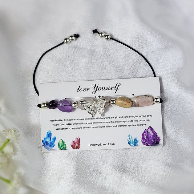 Crystal bracelet with a card reading love Yourself on a white background