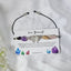 Crystal bracelet with a card reading love Yourself on a white background