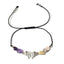 Necklace with butterfly charm and beads on a white background