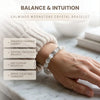 Moonstone crystal bracelet worn on a wrist with text highlighting benefits on a marble surface.
