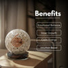 Crystal ball with engraved design on a wooden surface, labeled with benefits.