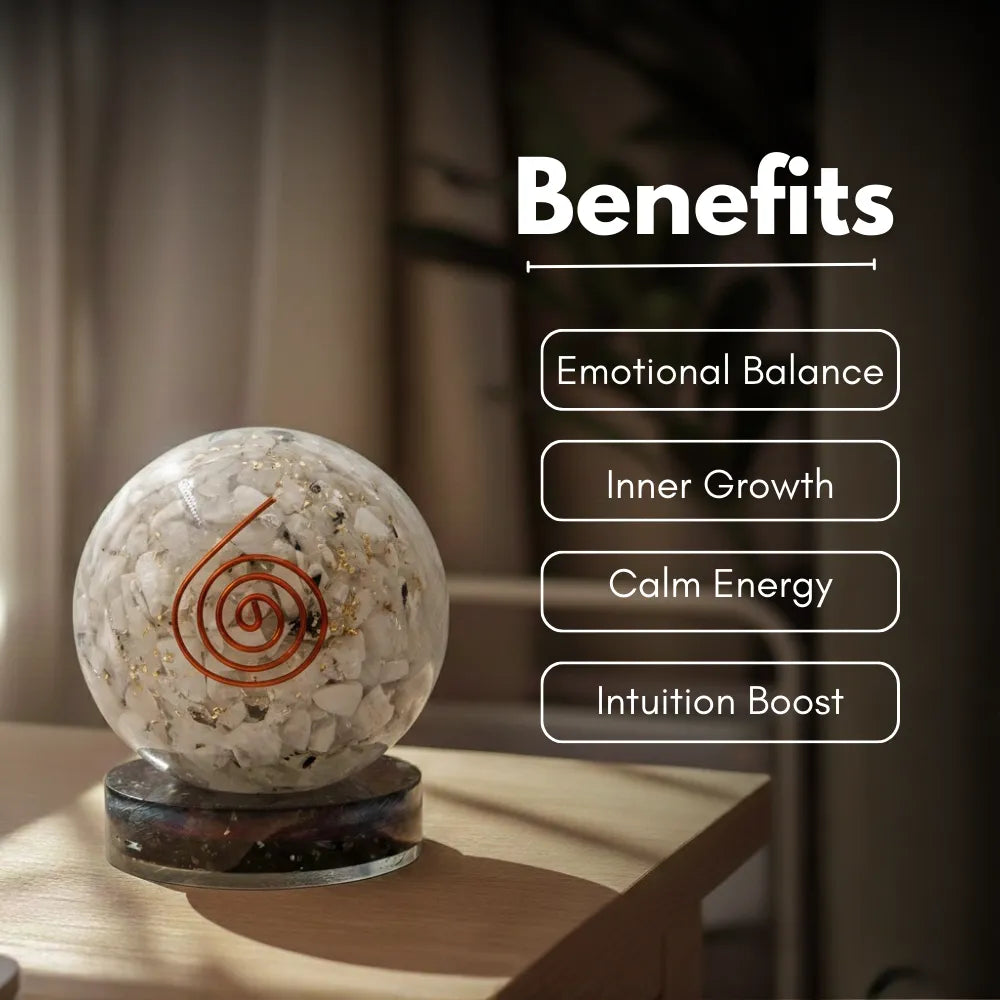 Crystal ball with engraved design on a wooden surface, labeled with benefits.